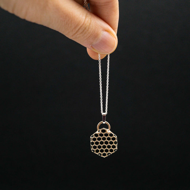 Golden honeycomb bee necklace made of bronze