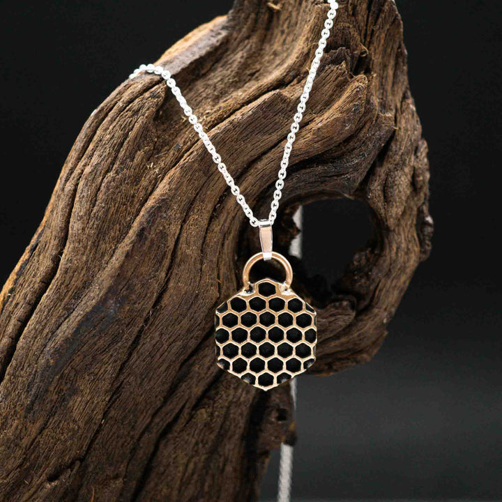 Golden honeycomb bee necklace made of bronze