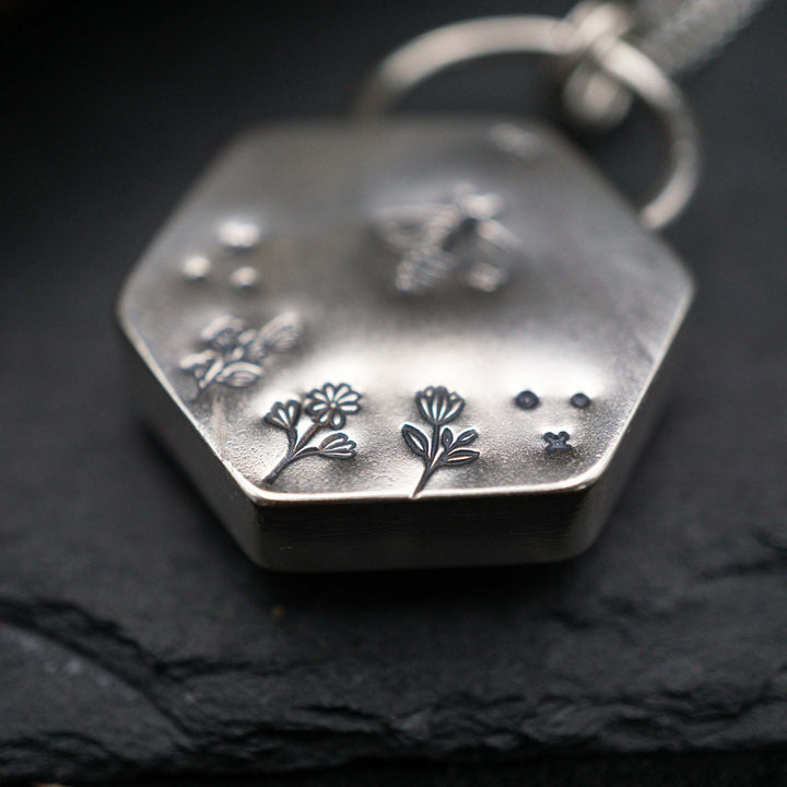 Filled honeycomb bee necklace made of real silver
